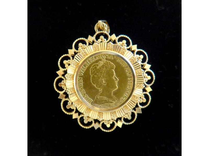 PENDENTIF en or jaune (750) orné d'une pièce...