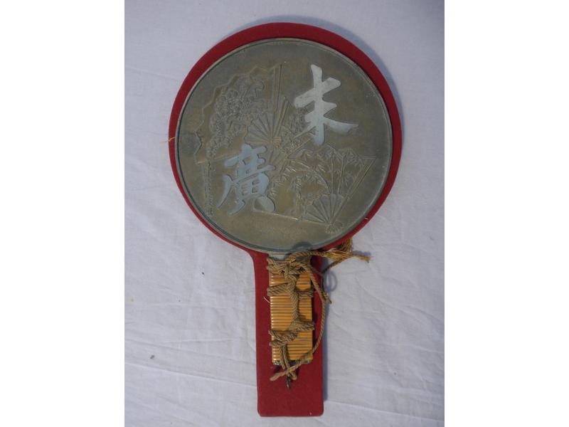 MIROIR à main en bronze, la prise tressée...