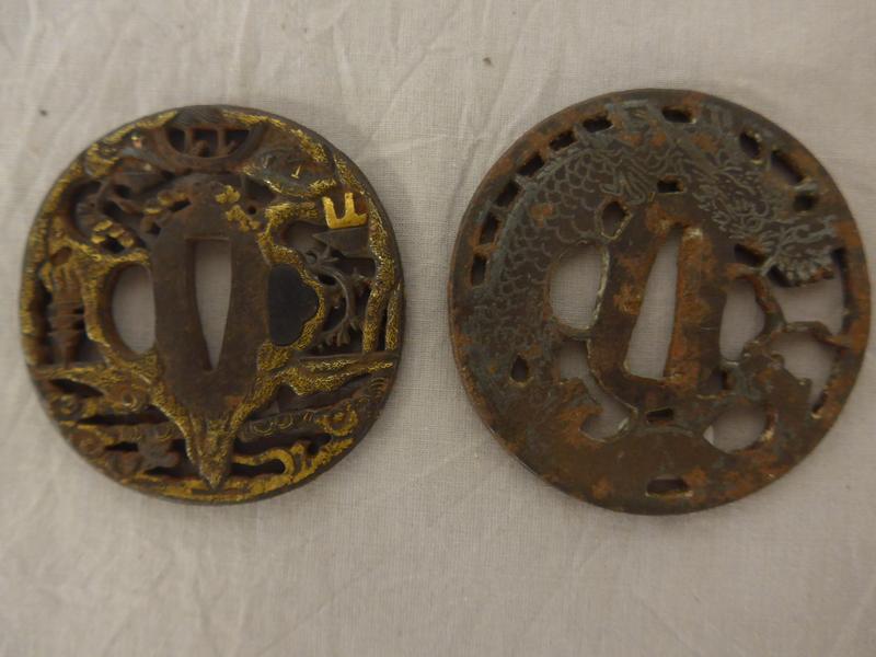 DEUX TSUBA en fer ajouré, l'un à décor de...