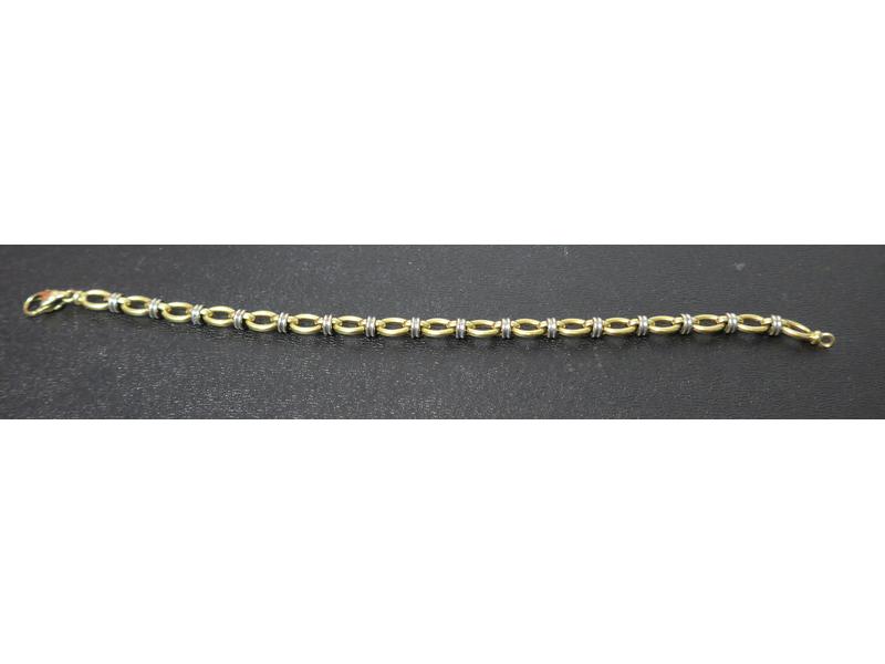 BRACELET gourmette en or jaune (750) et argent...