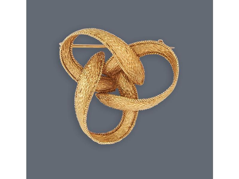 BROCHE en or jaune (750) en forme de noe...