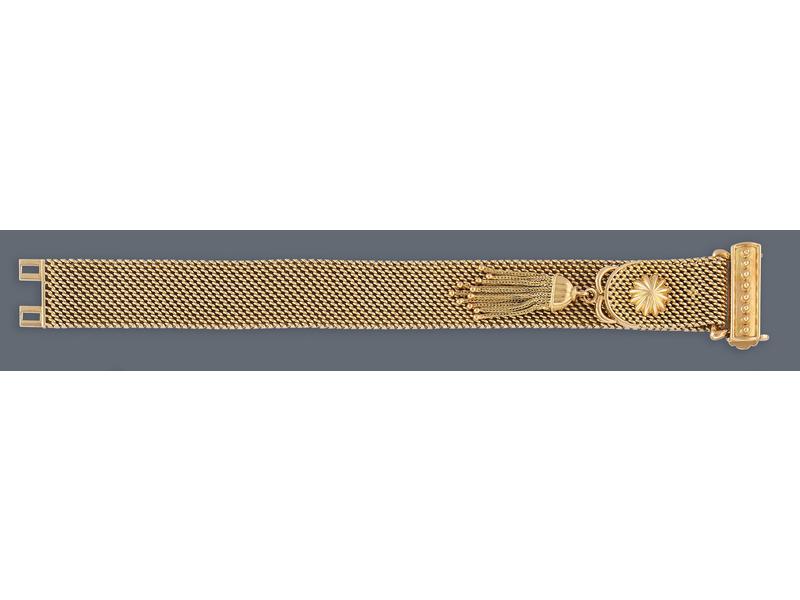 BRACELET souple type ceinture pompon en or...