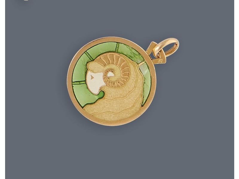 MEDAILLE ronde, à décor d'une tête de bélier...