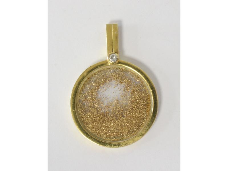 PENDENTIF en or jaune (750) de forme circulaire...