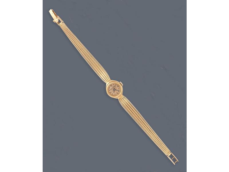 MONTRE bracelet de dame en or jaune (750)...