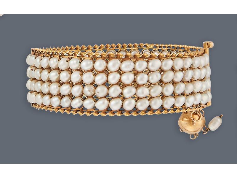 BRACELET manchette articulé en or jaune (750)...