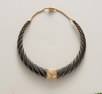 COLLIER TORQUE en or (750), à branches torsadées...