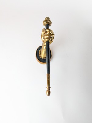 APPLIQUE en bronze doré et patiné noir à...