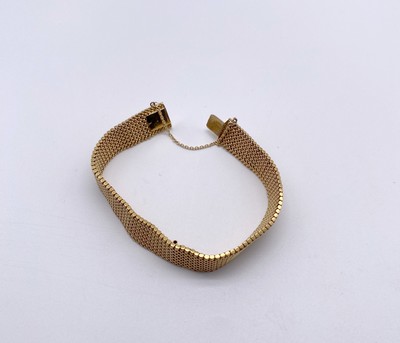 BRACELET ruban souple en or (750) avec chaîne...