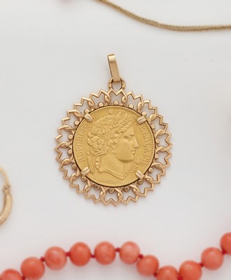 PENDENTIF en or (750) sertissant un 20 F...