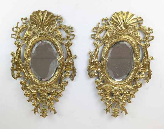 PAIRE DE PETITS MIROIRS ovales biseautés...