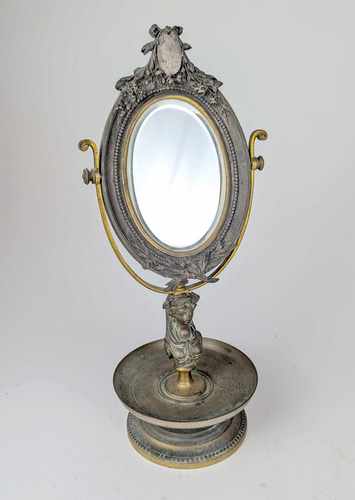 MIROIR DE TABLE ovale en psychée, en bronze,...