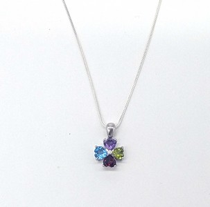 PENDENTIF fleur en argent (925) orné de pierres...
