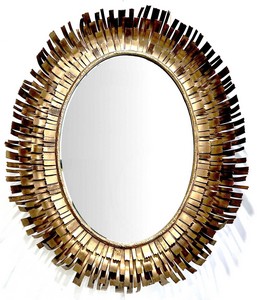 MIROIR ovale biseauté, dans un cadre en tôle...